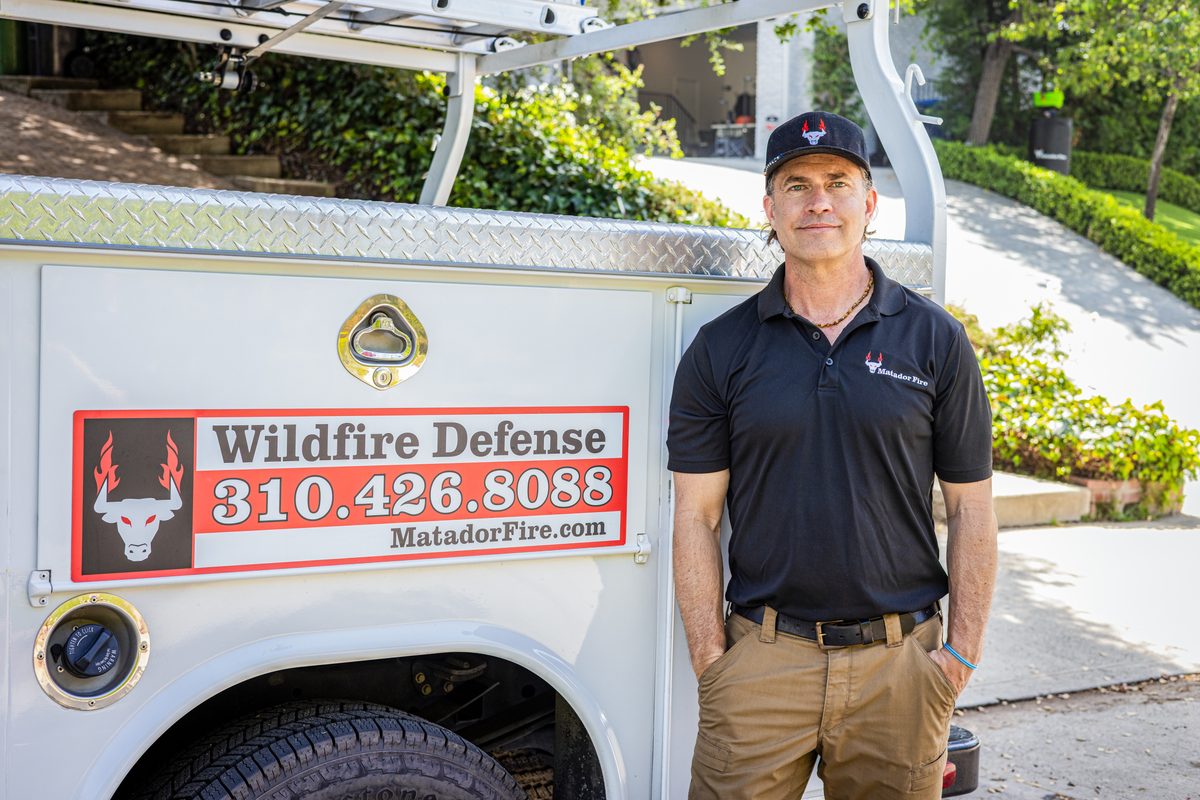 Nate Snyder, CEO & Founder of Matador Fire, standing next to a Matador Fire service truck