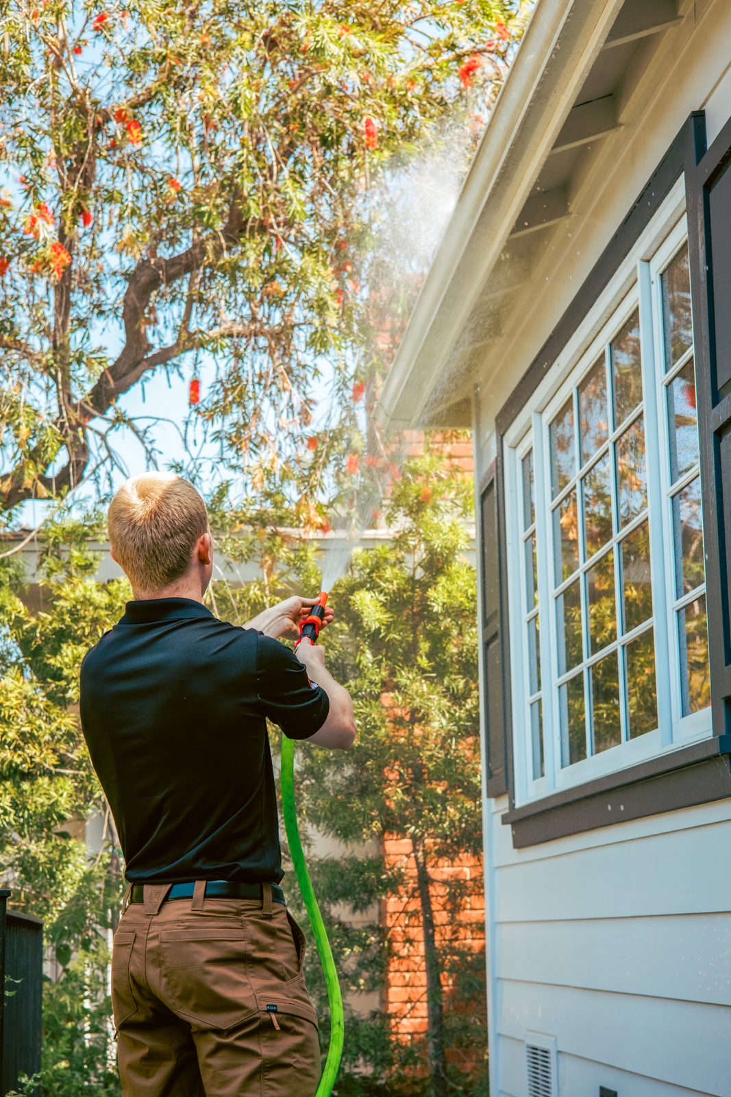 Matador Fire technician applying fire retardant to a home